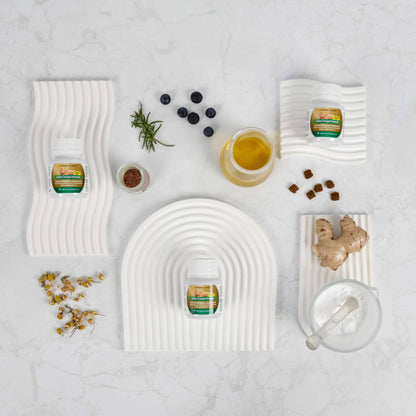 White woven trays with various items on a light gray background